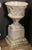 A fine large English garden Campana urn (or planter pot) on plinth of composition stone, featuring a round urn with...