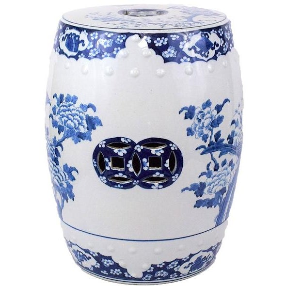 This is a beautiful blue and white porcelain garden stool with a vibrant design of birds in a floral and botanical setting...