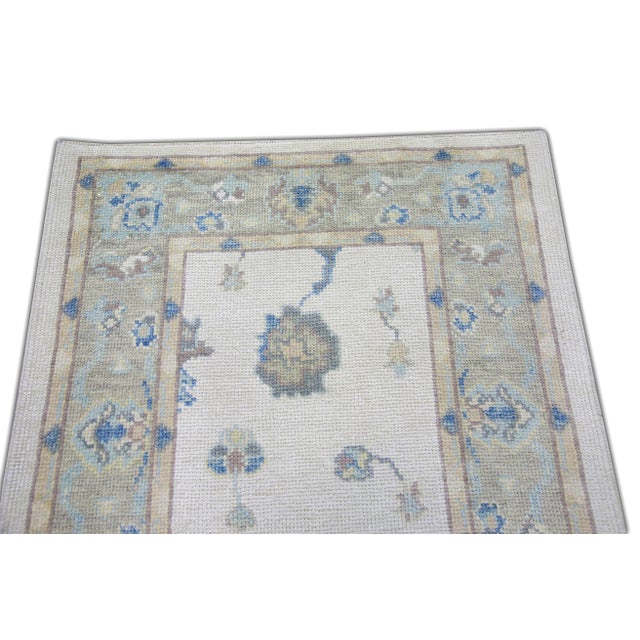 Turkish Oushak Rug Ivory Blue Handwoven Wool Runner 3'1" X 11'5" This Turkish Oushak runner is crafted from handwoven wool...
