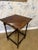 Such a lovely piece of history, this side table features distinctive barley twist legs and a delicate scalloped top. This...