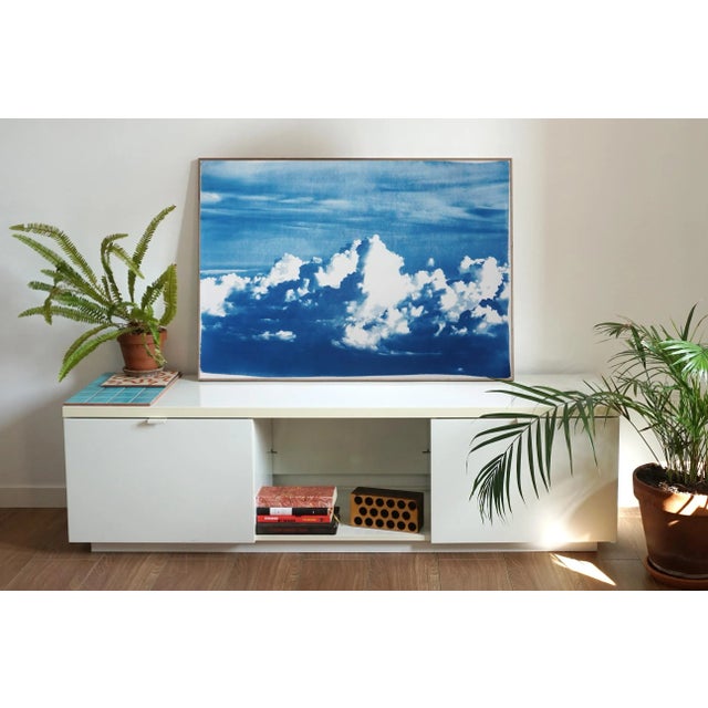 This is an exclusive handprinted limited edition cyanotype. "Blustery Clouds" is an cyanotype of the semi-abstract...