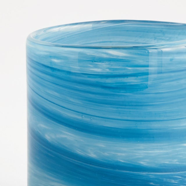 A modern update to the simple glass vessel, the Del Mar Glass Hurricane is made of vibrant shades of blue. The color is...