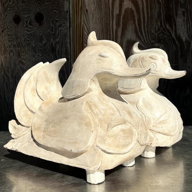 This exquisite pair of vintage Asian carved Mandarin wood ducks showcases exceptional craftsmanship and timeless elegance....