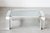 Flat, space age coffee table in a high quality brutalist design made in Germany. It has a large sculptural structure, made...