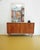 A vintage Danish teak sideboard from the 1950s with sliding doors and an elegant, compact design, perfect for a functional...