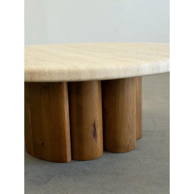 W36 D36 H14 This Enzo coffee table by Six Penny features a warm beige round solid travertine stone top paired with a...