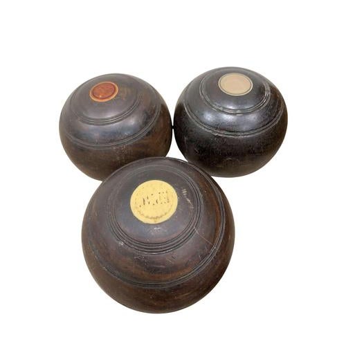 A nice collection of twenty wooden English lawn bowls from the early 1900s. Used but in decent condition (one has a split...