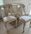 Bleached wood French Empire style side chairs in great vintage condition. Seat cushions are upholstered in a neutral sand...