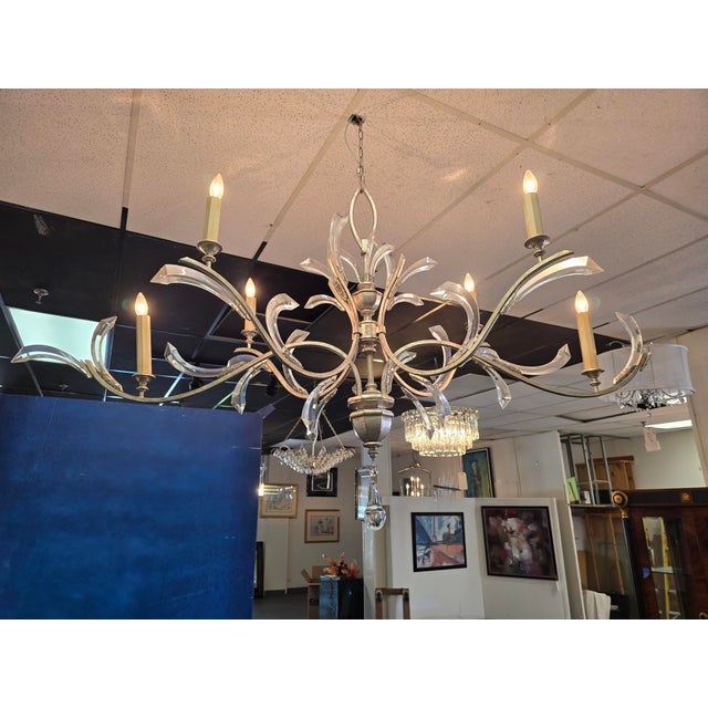 Stunning Fine Arts Chandelier with beveled arches, crystal accents, and 6 bulbs. The crystals are wired in. The will be...