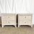 A charming pair of Boho Chic nightstands, beautifully crafted in white-washed wicker with braided trim and original glass...