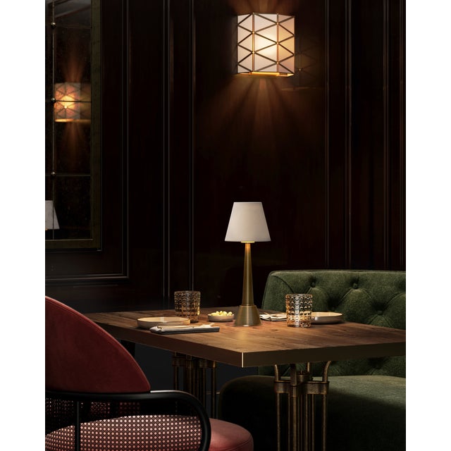 The Saunter Brass Cordless Table Lamp is a gold lamp that takes its name seriously, as it can be moved around with ease....