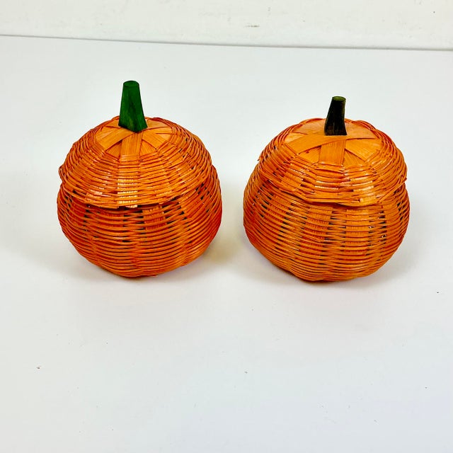 These are a pair of wicker Pumpkin Lidded Wicker Boxes. They are in the Trompe L’Oeil style from the 1970s. Perfect as...