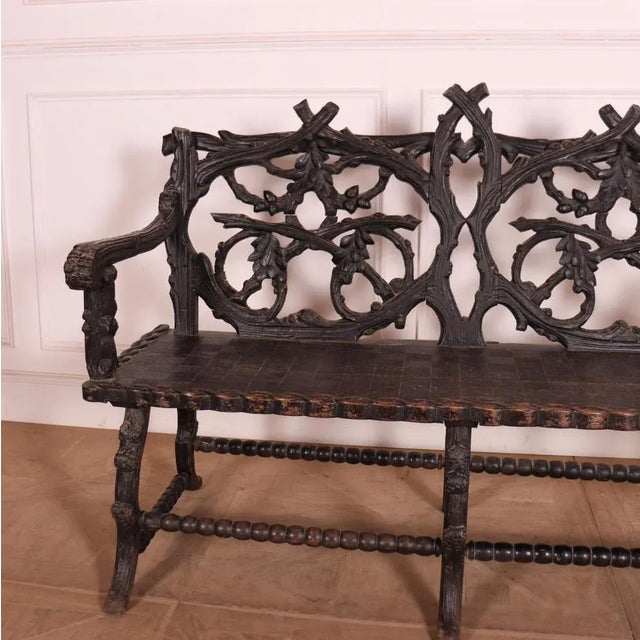 Victorian Black Forest carved bench seat. Back carved with branches, oak leaves and acorns. Patterned seat with scroll...