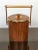 Italian ice bucket in teak and gold metal details, circa 1960s. The "Made in Italy" engraving is visible on the bottom, as...