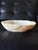 Beautiful low-profile bowl carved from natural onyx, with a softly irregular organic form and luminous ivory coloring. The...