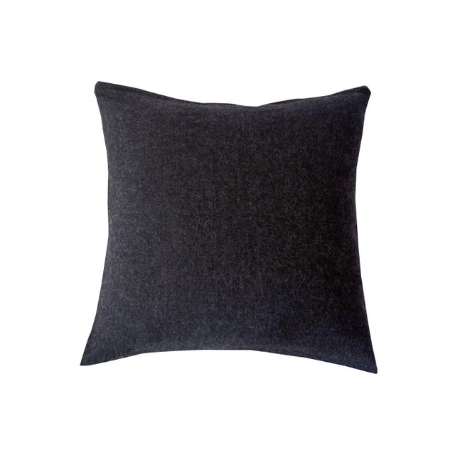 Jacquard loomed pillow of baby alpaca inspired by the Pampa design of the Mapuche Indians. Natural yarns are spun and...