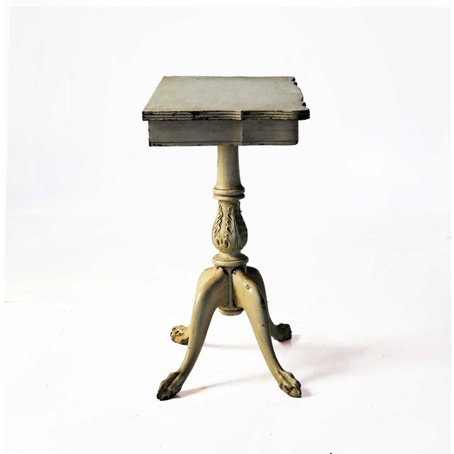 Antique French Provincial pedestal side table with a single central column (pedestal) support with ornate carvings....