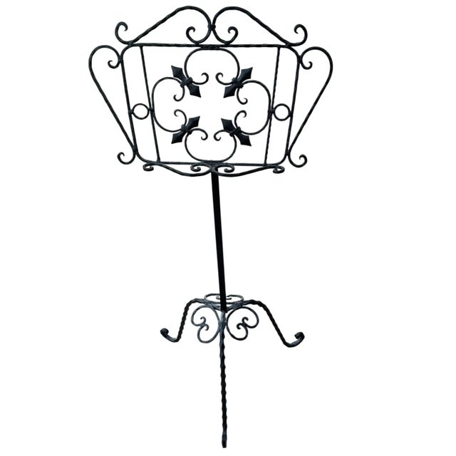 Beautiful wrought iron music stand. This can be used for many purposes including a music stand, book stand or painting...