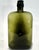 A handsome vintage olive green glass apothecary bottle retaining its original dark glass stopper with cork. The bottle's...