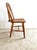 Rustic farmhouse bow-back side chair in solid hardwood with a warm, timeworn patina. A gently arched back, slim spindles...