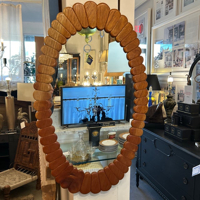 Very unique mirror made of individual solid wood pedal-like shapes. The design of this mirror conjures up thoughts of...