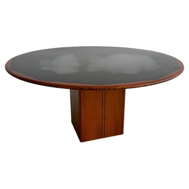 Artona dining table by Afra & Tobia Scarpa, crafted by Maxalto in Italy, 1975. Featuring a round walnut top with dark...