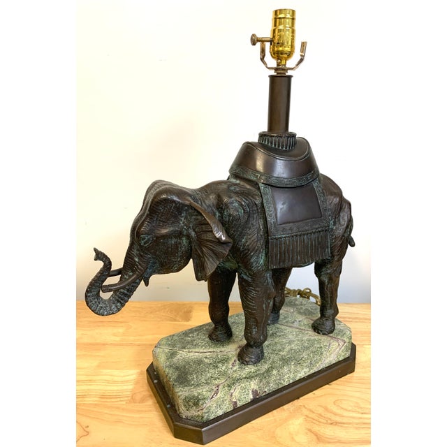 Maitland-Smith Bronze Asian Elephant Table Lamp on Serpentine Marble Base An elegant bronze elephant table lamp by...