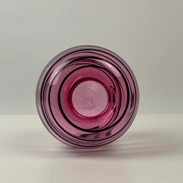 1994 hand blown studio art glass by John Hamon Miller Pink glass with a black swirl Artist signed and dated Decorative...