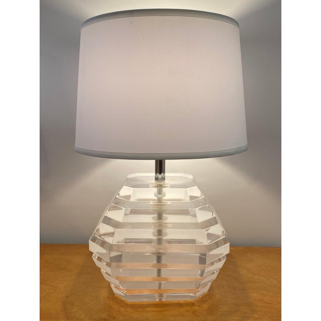 Gorgeous heavy chunky stacked Lucite lamp by George Bullio, circa 1970. Featuring a tiered construction, the body of the...