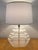 Gorgeous heavy chunky stacked Lucite lamp by George Bullio, circa 1970. Featuring a tiered construction, the body of the...