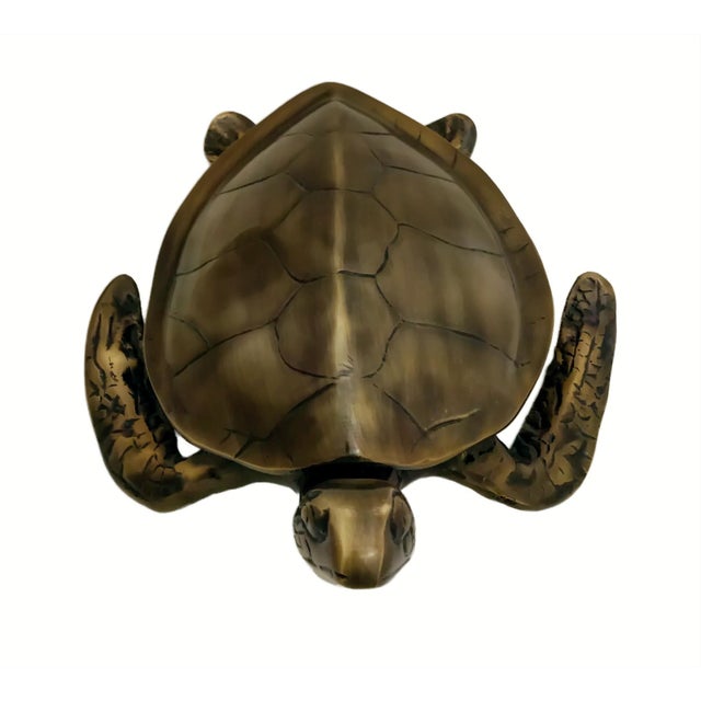 Upgrade your home décor with this striking antique-style sea turtle sculpture, expertly crafted from real metal and...