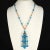 This is part of Chairish’s Costume Jewelry assortment. Vintage necklace with 4 1/2" tassel dangling from a chain made...