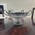 This elegant serving vessels is crafted from pewter and features a fluted body, decorative handles, and a pedestal base....