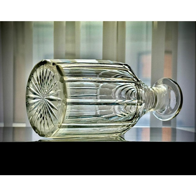 This elegant English cut glass decanter dates to the Regency period, circa 1835. Crafted in clear lead crystal, it...