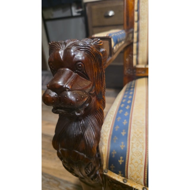 My brother came across this chair when he lived in Grass Valley, ca had to move because of illness lions heads on arms...