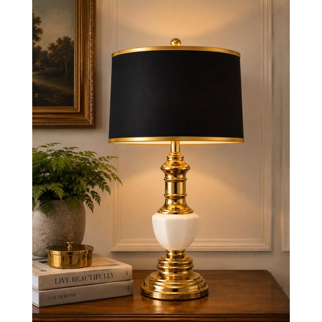 Bring timeless elegance into your home with this beautifully restored vintage brass and milk glass table lamp, a...