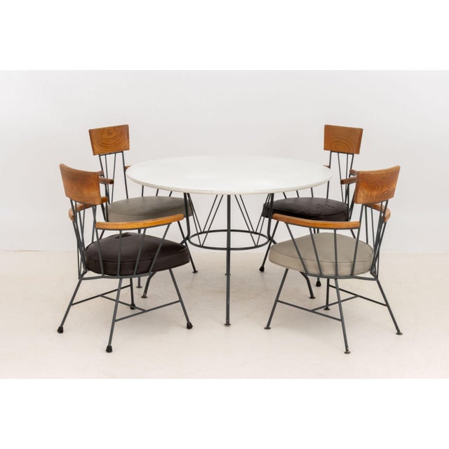 Richard McCarthy (American, 1926-2002) for Selrite Five-Piece Dining Room Set, comprising a circular white laminate top...