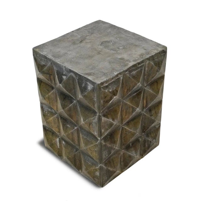 With its bold faceted geometry and richly patinated bronze/brass finish, this sculptural aluminum side table makes a...