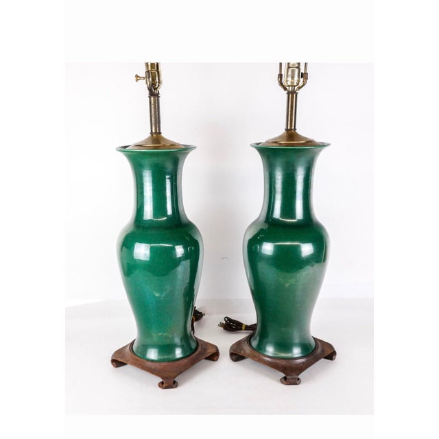 A striking pair of 19th century Chinese porcelain vases, now elegantly mounted as table lamps, celebrated for their rich,...