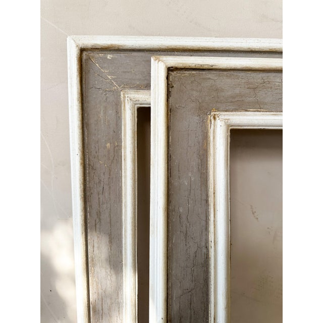 Pair of large 19th century Italian wooden frames with beautifully aged patinated finishes. Both pieces stand out for their...
