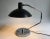 This desk lamp, Model No. 8, was designed by Clay Michie and manufactured by Knoll International in the 1960s. It has a...