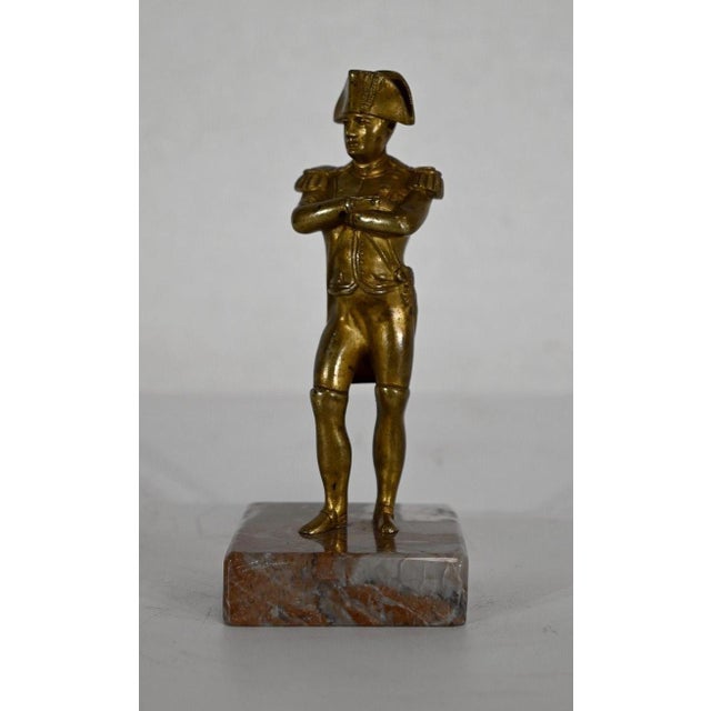 Bronze subject with golden patina representing Napoleon Bonaparte. The emperor is represented standing, the right leg...