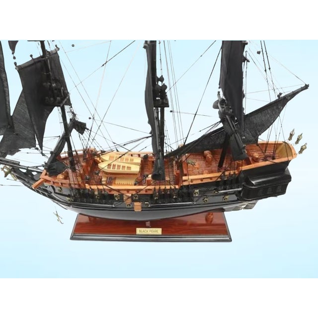 Bring the legend of the high seas home with this expertly handcrafted replica of the Black Pearl. Whether you are an...