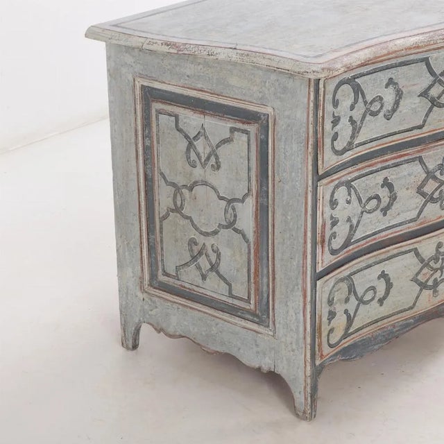 This beautiful three-drawer commode dates to the 18th century (likely French) and has a subtle serpentine front façade....
