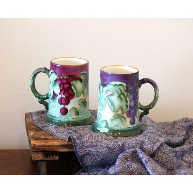 A lovely pair of John Pouyat Limoges (JPL) hand painted tea mugs/tankards. No chips or cracks, these are very clean and...