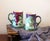A lovely pair of John Pouyat Limoges (JPL) hand painted tea mugs/tankards. No chips or cracks, these are very clean and...