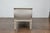 A French Louis XVI style painted wood daybed from the 19th century with foliage carved decor and custom upholstery. This...