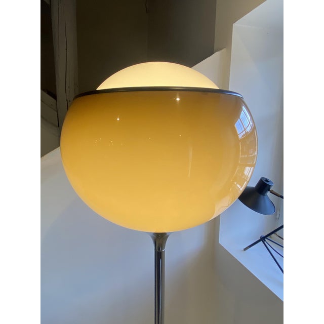 Beautiful floor lamp by Guzzini, produced in the 1960s. This is the large model, 45cm in diameter, with a lovely color....