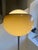 Beautiful floor lamp by Guzzini, produced in the 1960s. This is the large model, 45cm in diameter, with a lovely color....