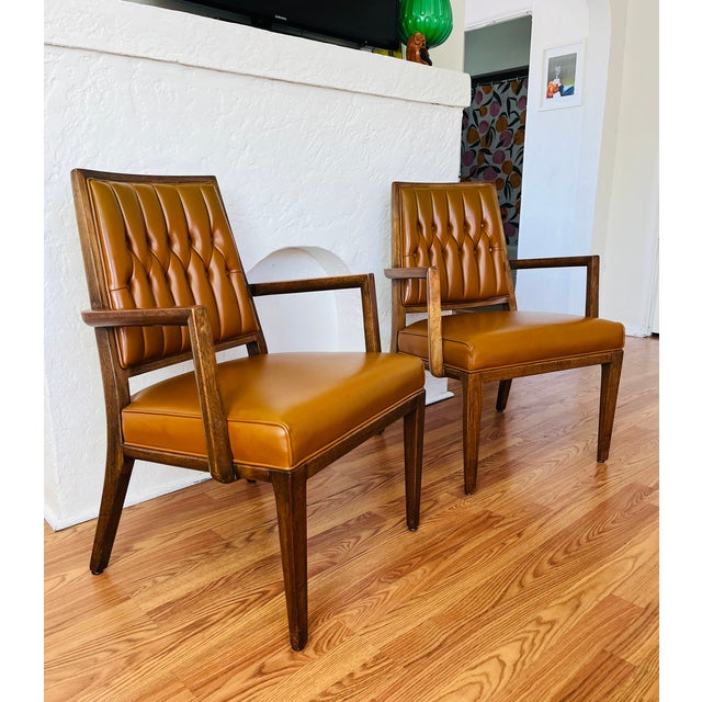 Pair of Monteverdi Young Vintage mid-century modern walnut armchairs designed by Maurice Bailey in 1969. These were...